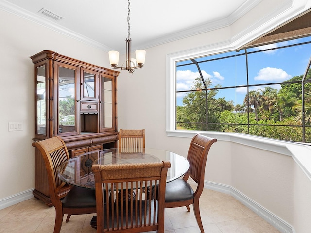 dining area with ornamental molding, a chandelier, and light tile patterned floors