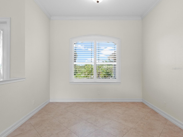 tiled spare room with ornamental molding