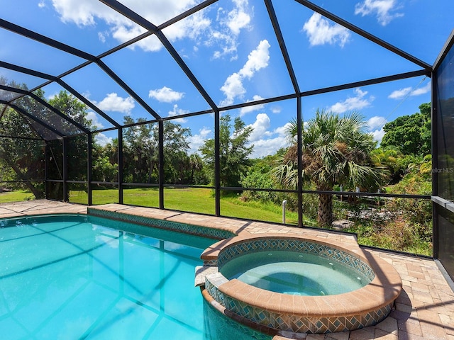 view of swimming pool with a lanai and an in ground hot tub