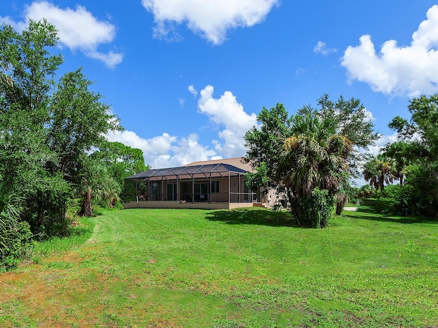 view of yard with a lanai