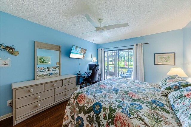 bedroom featuring a textured ceiling, access to outside, ceiling fan, and dark hardwood / wood-style floors