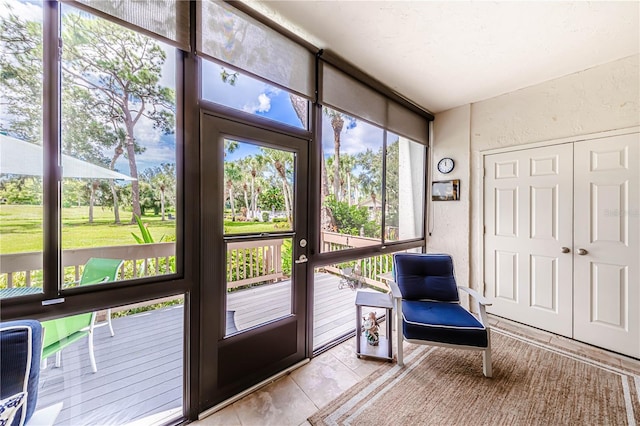 doorway to outside featuring light tile patterned flooring