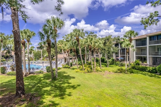 view of yard with a community pool