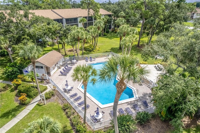 view of swimming pool with a patio area and a lawn