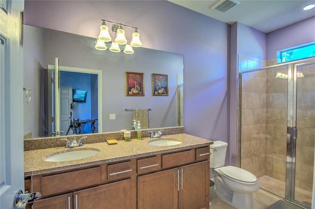 bathroom with a sink, visible vents, toilet, and a stall shower