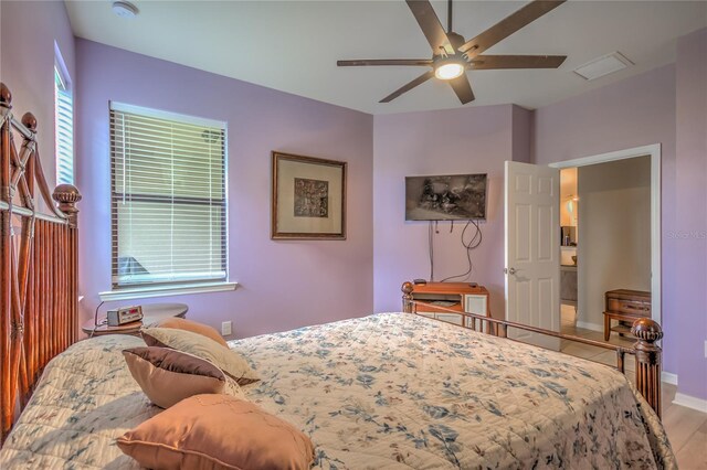 bedroom with ceiling fan and light hardwood / wood-style floors