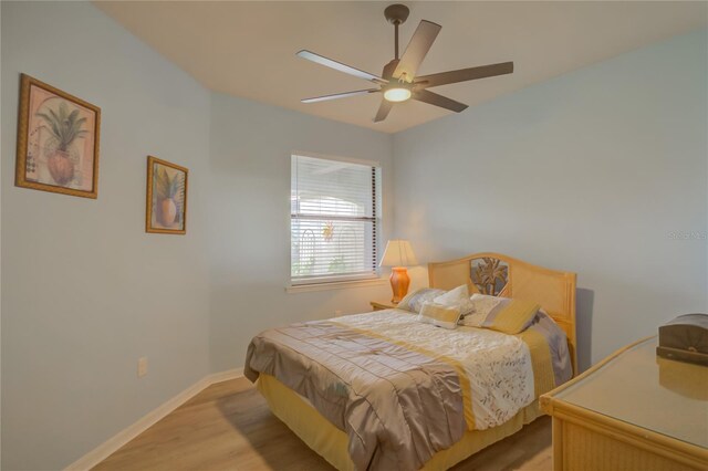 bedroom featuring ceiling fan and light hardwood / wood-style flooring