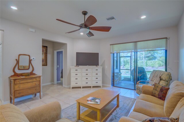 living room featuring ceiling fan and light tile patterned floors