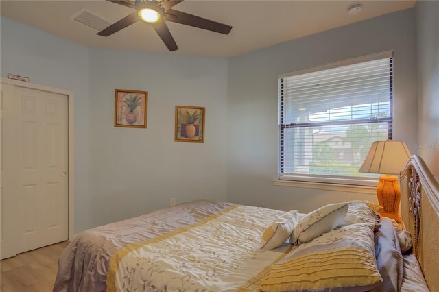 bedroom featuring light hardwood / wood-style flooring and ceiling fan