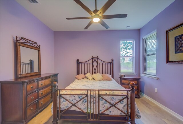 bedroom featuring light wood-type flooring and ceiling fan