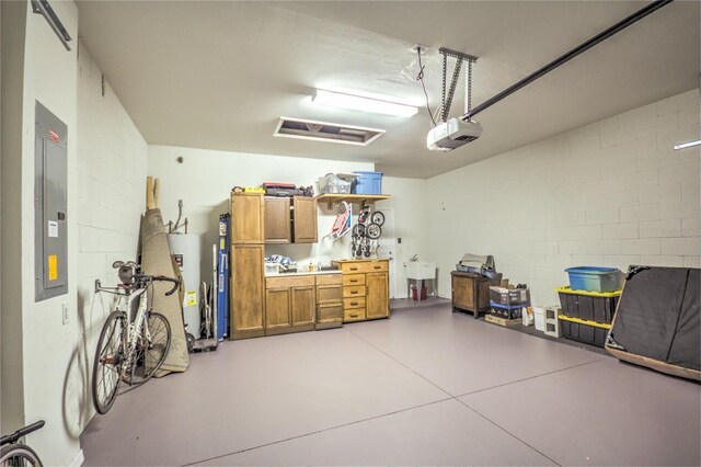 garage featuring electric panel, gas water heater, sink, and a garage door opener