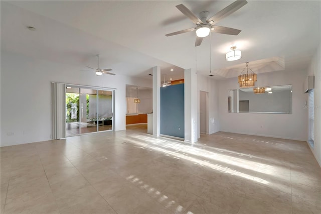 tiled spare room featuring ceiling fan with notable chandelier and baseboards