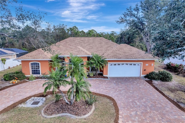 single story home featuring a garage