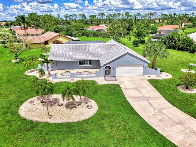 view of front of house with a front lawn and a garage