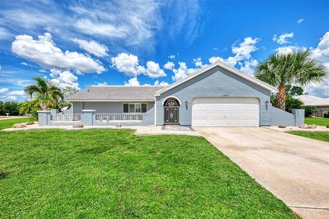 single story home featuring a garage and a front lawn