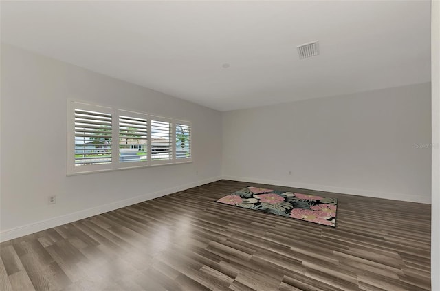 empty room featuring hardwood / wood-style flooring