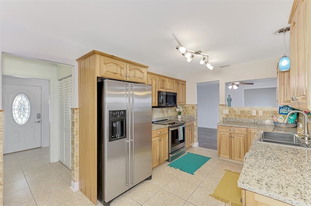 kitchen with backsplash, stainless steel appliances, sink, light brown cabinets, and ceiling fan