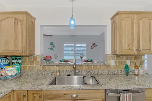 kitchen with light brown cabinetry, dishwasher, tasteful backsplash, and sink