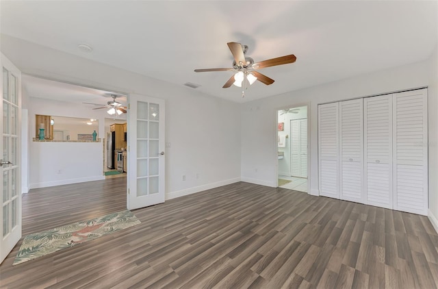 interior space with french doors, ceiling fan, and dark hardwood / wood-style floors