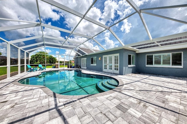 view of pool featuring a lanai and a patio