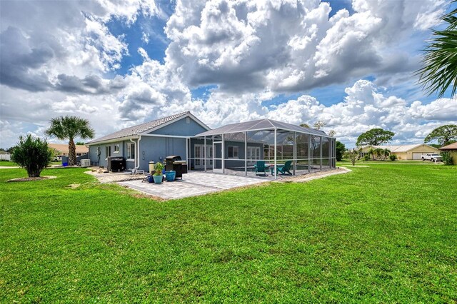 rear view of property featuring a lawn, a lanai, a patio, and a swimming pool