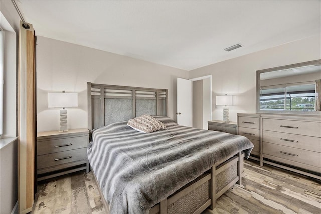 bedroom with light wood-type flooring