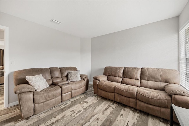 living room with light hardwood / wood-style flooring