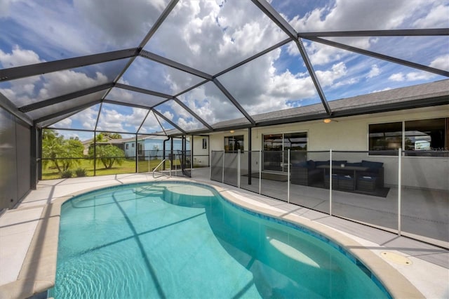 view of pool with a lanai and a patio