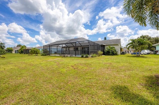 view of yard featuring glass enclosure