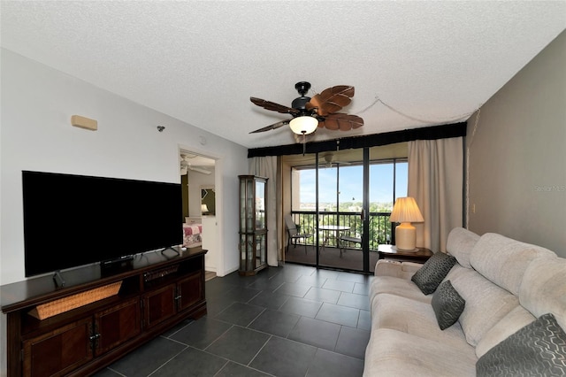 living room featuring a textured ceiling and ceiling fan