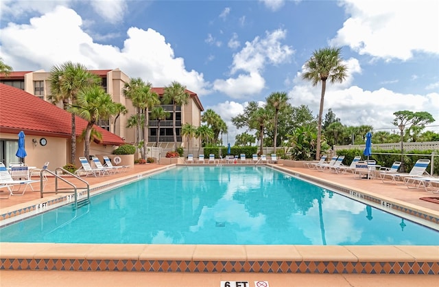 view of swimming pool with a patio area