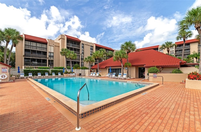 view of swimming pool featuring a patio area