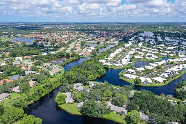 birds eye view of property featuring a water view and a residential view