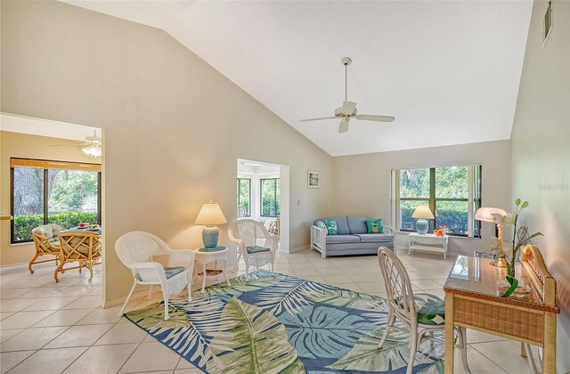 living room with plenty of natural light and ceiling fan