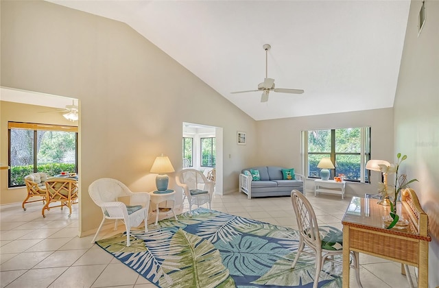 living area with a ceiling fan, light tile patterned flooring, plenty of natural light, and visible vents