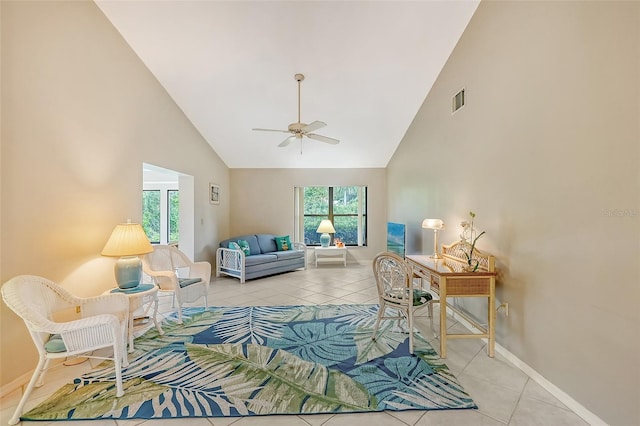 living room with ceiling fan, light tile patterned floors, and high vaulted ceiling