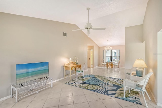 tiled living area featuring baseboards, visible vents, vaulted ceiling, a textured ceiling, and ceiling fan with notable chandelier