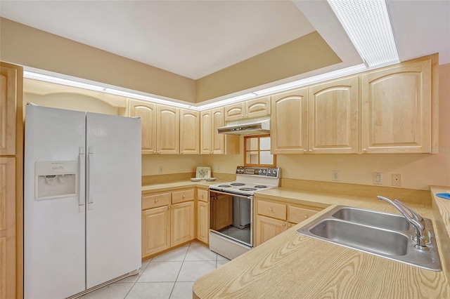 kitchen featuring light tile patterned floors, white appliances, light brown cabinetry, and sink