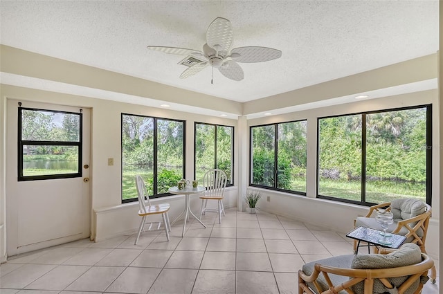 sunroom / solarium with ceiling fan and plenty of natural light