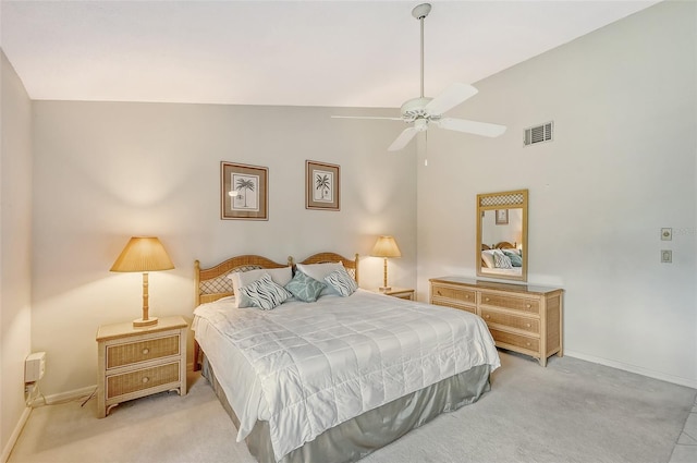 bedroom with ceiling fan, light carpet, and high vaulted ceiling