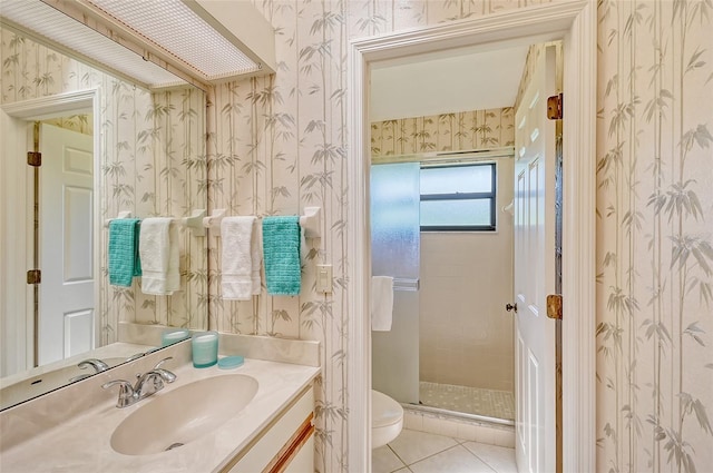 bathroom with a shower with shower door, tile patterned flooring, toilet, and vanity