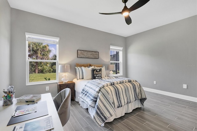 bedroom featuring ceiling fan and dark hardwood / wood-style flooring