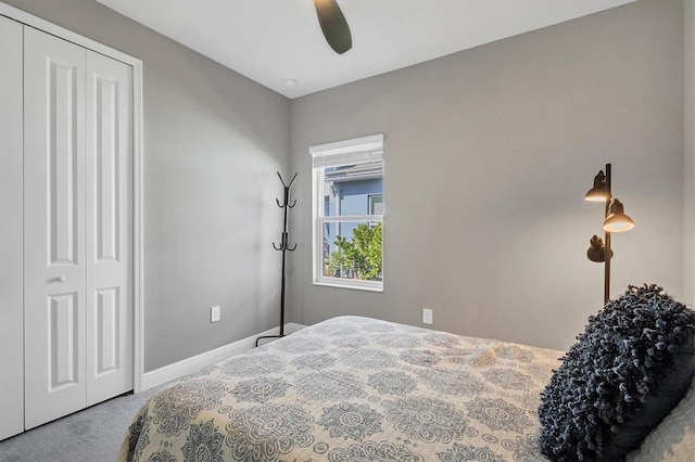 bedroom with carpet flooring, ceiling fan, and a closet