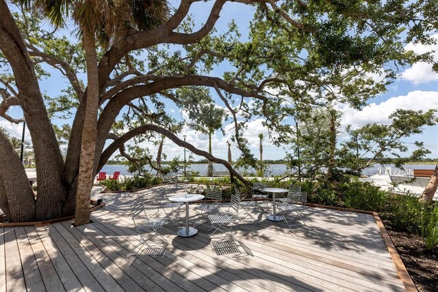 wooden deck featuring a water view