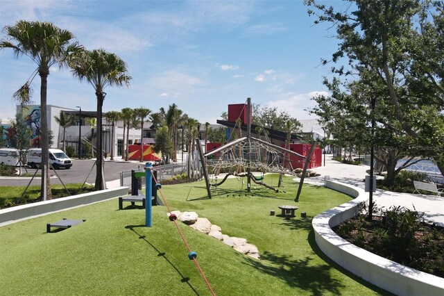 view of home's community with a yard and a playground