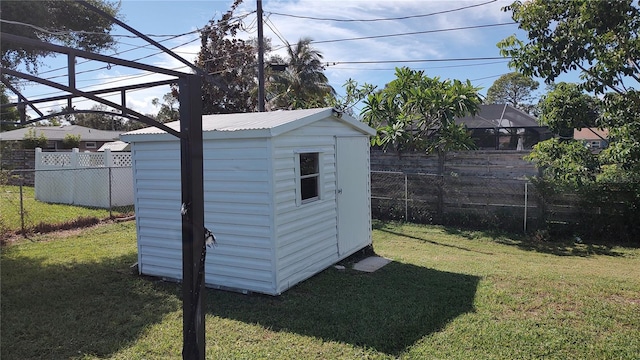 view of outbuilding featuring a lawn