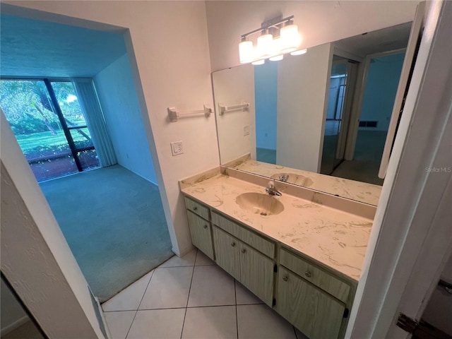 bathroom with tile patterned flooring and vanity