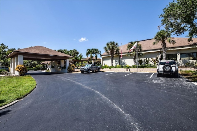 view of parking with a carport