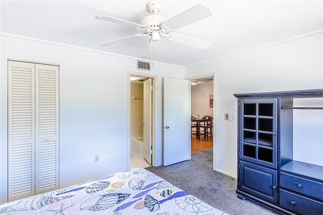 unfurnished bedroom with crown molding, a closet, ceiling fan, and carpet