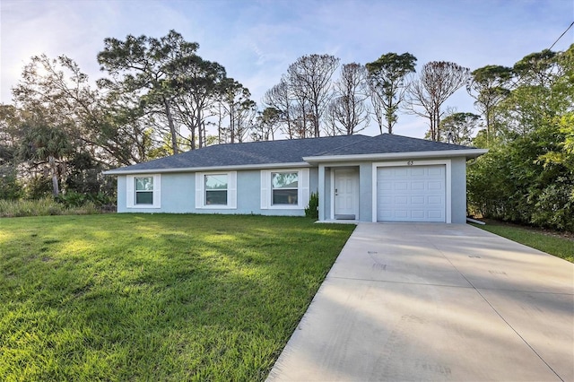 ranch-style house featuring a garage and a front yard